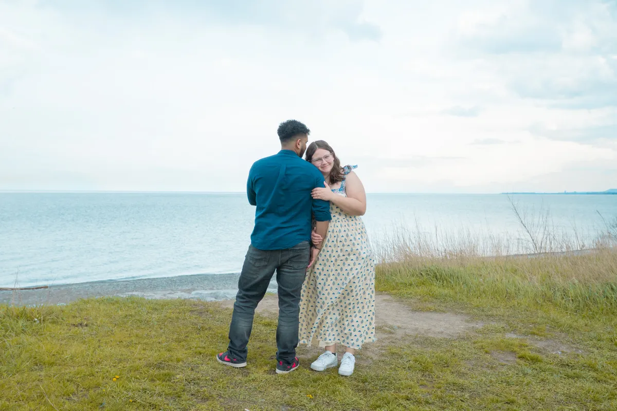 Couple embracing after surprise proposal in Kitchener-Waterloo