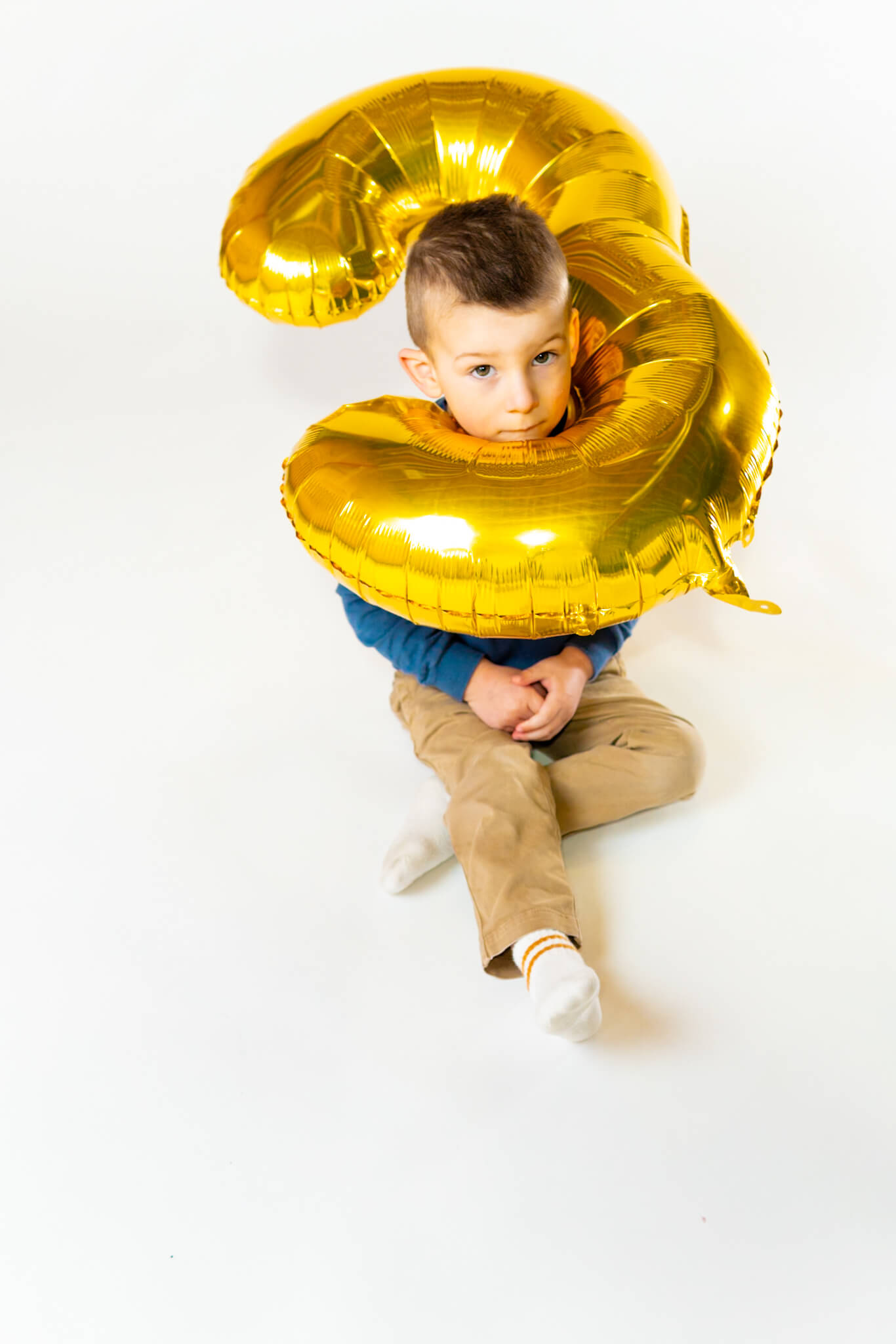 Fun studio birthday photo of boy by Greasypixel Photography in Kitchener