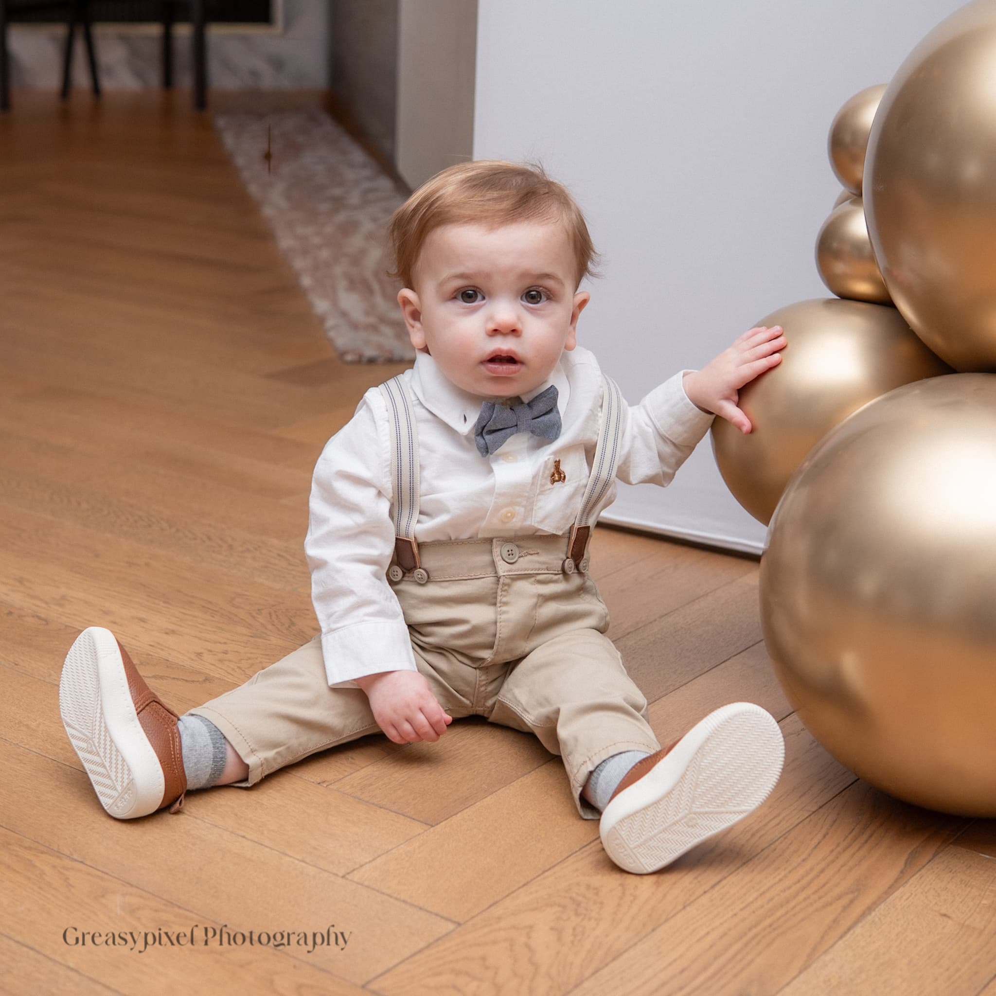 Birthday party photography Cambridge - baby portrait with balloons