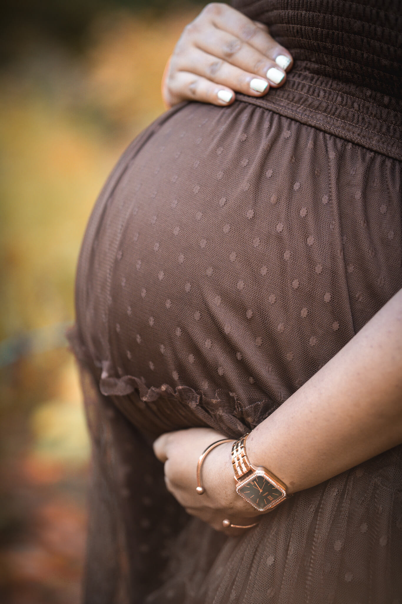 Detailed close-up of a mother-to-be's baby bump
