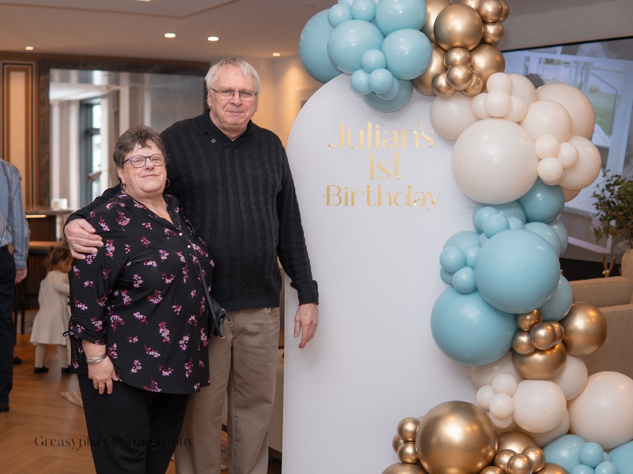 Birthday party photographer Kitchener - couple with baby and balloons