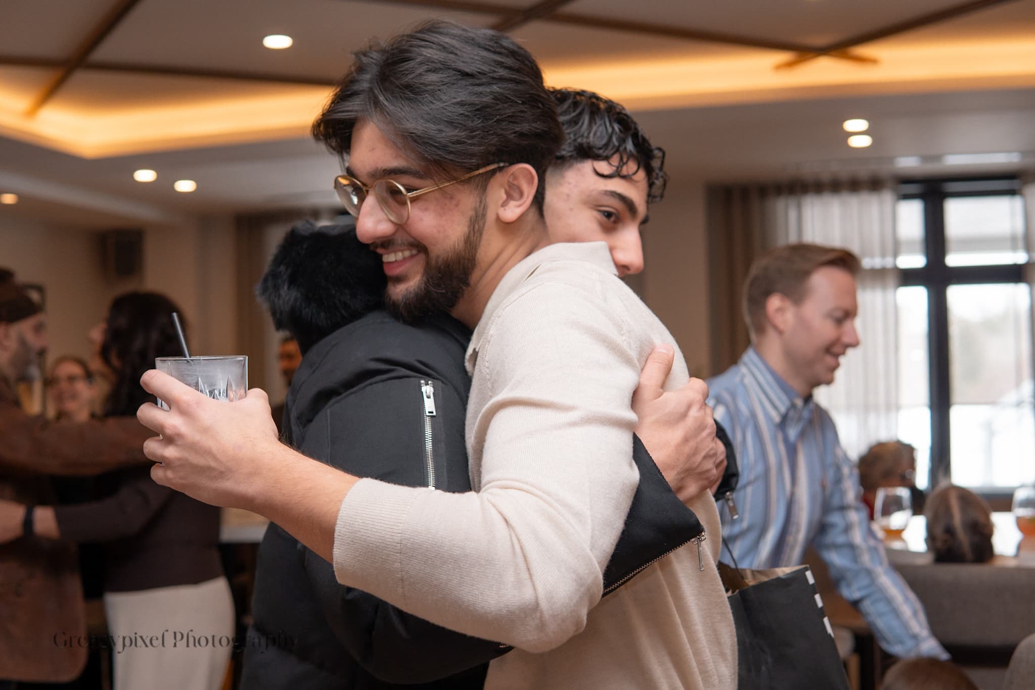 Event photography Kitchener - candid moment of party guests