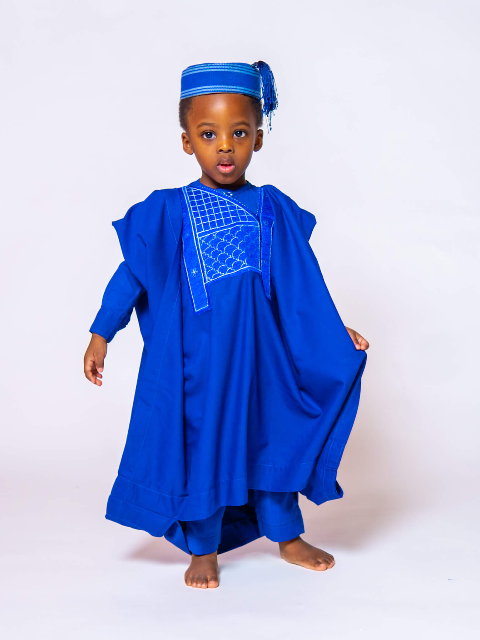 Birthday boy posing in cultural clothing at Greasypixel Photography